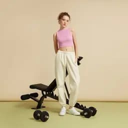 Model in beige outfit on studio equipment